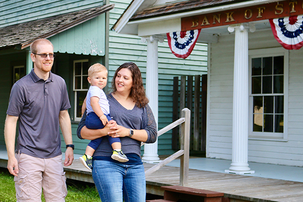 Family exploring Stonepoint's 1900s Farming Village